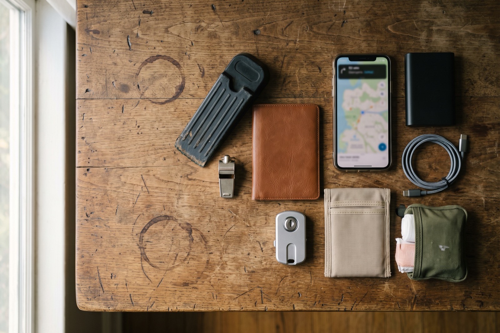 Flatlay of a compact solo travel safety kit